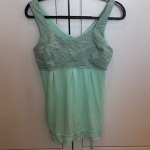 Size 10 Lululemon top with gathered hem. Like new